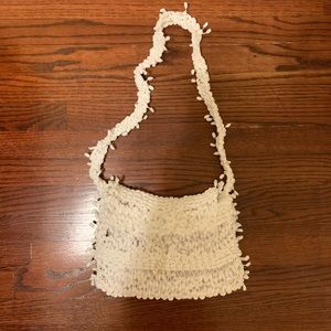 Bundle of white scarf and purse
